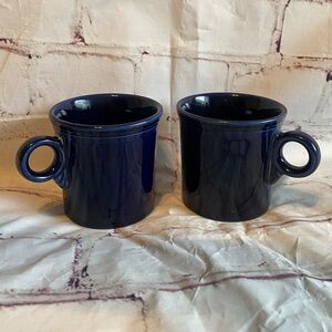 Vintage Fiestaware cobalt blue ceramic mugs, sold as a set of two.